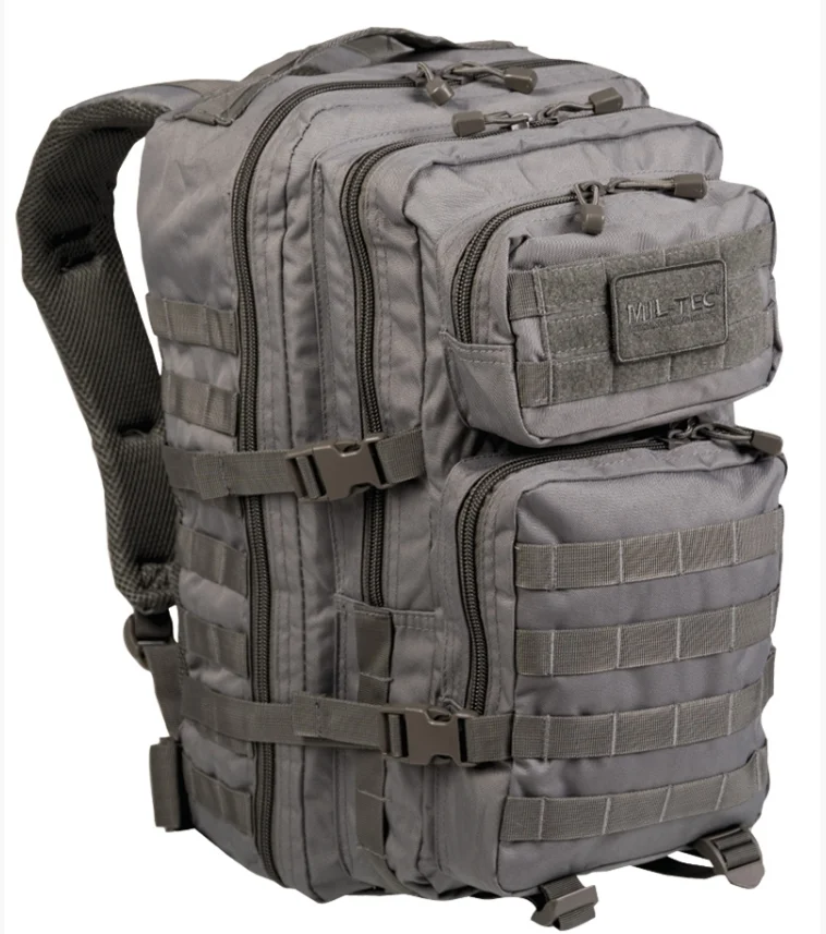 Sac à dos tactique 36L gris, molletonné avec attaches MOLLE, poches zippées et poignée frontale sur le sac.