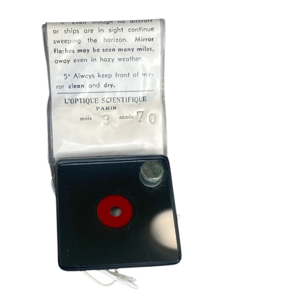 Miroir SOS type 644 de signalisation de survie militaire compact avec bouton rouge et écriteau explicatif.