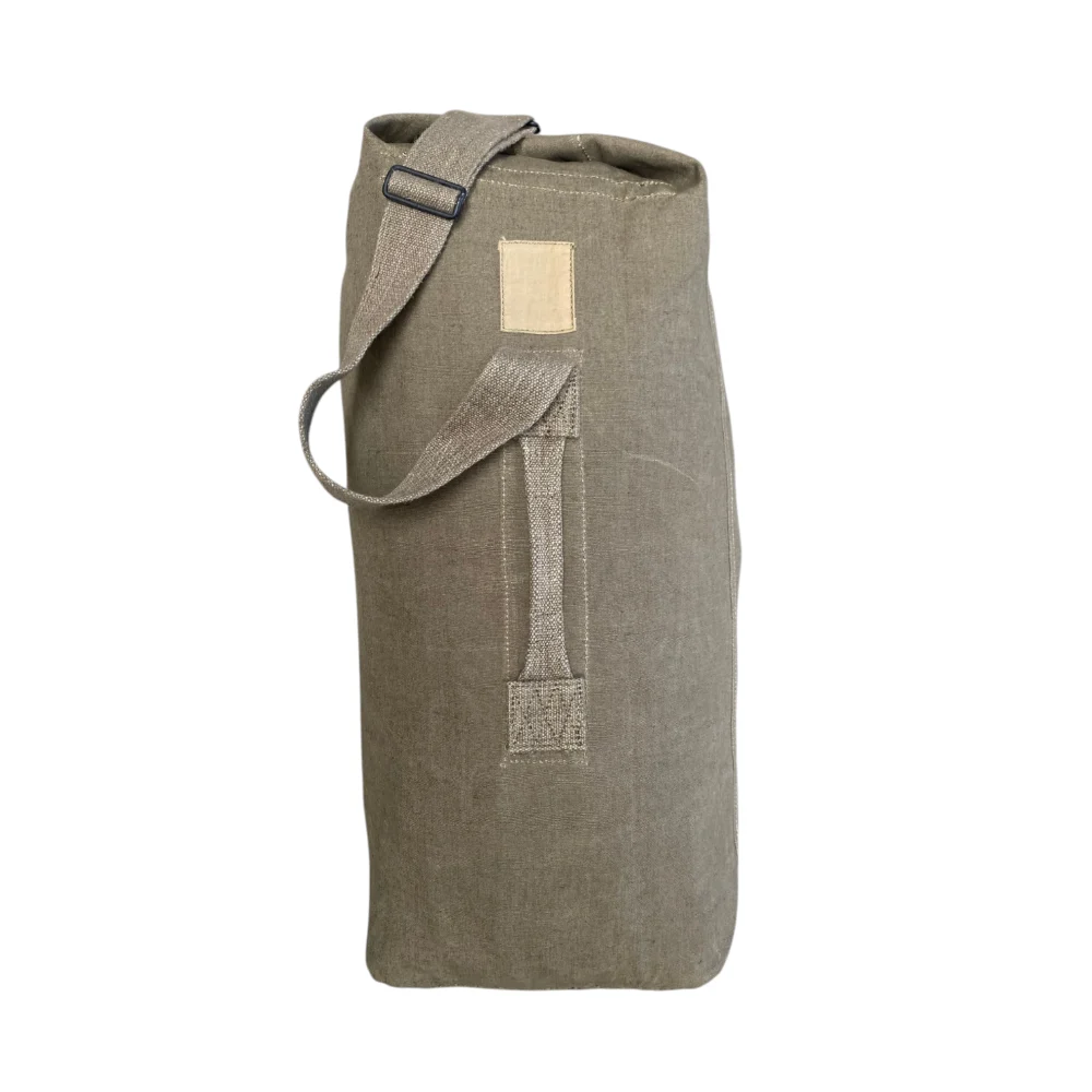 Sac de transport 50L en toile et coton robuste, livré avec bandoulière et anses pour le bivouac et le camping outdoor.